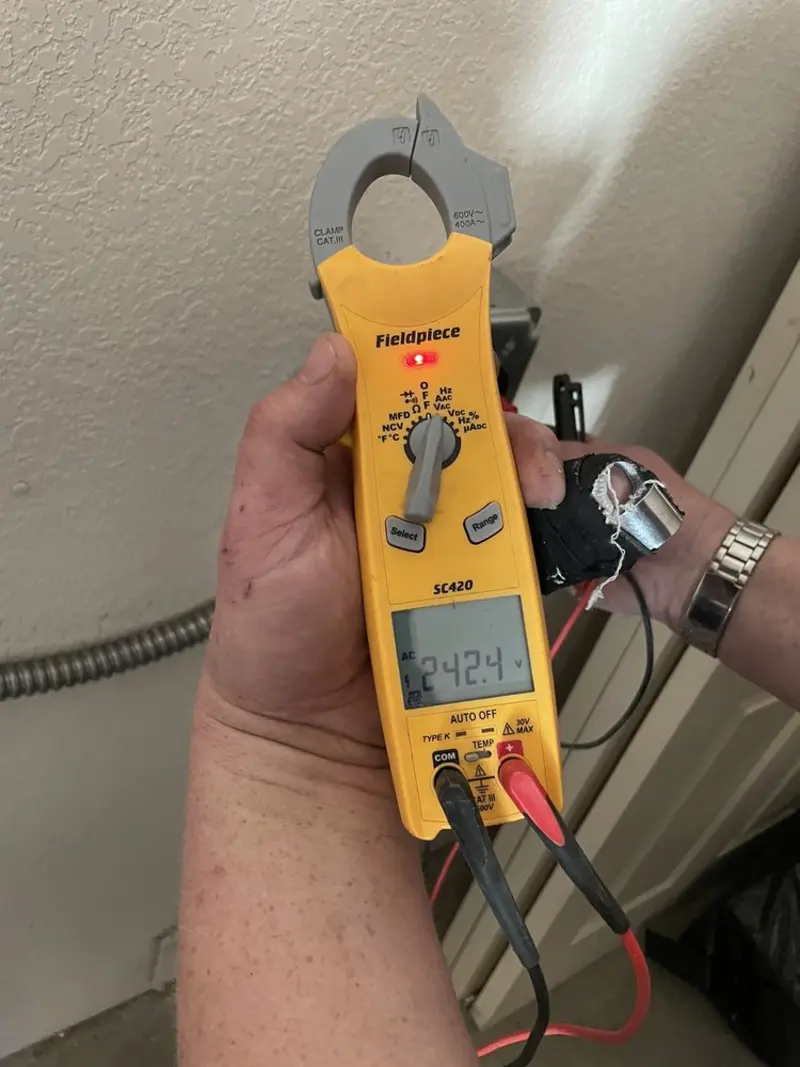 Voltage testing with clamp meter during Generator Installation in Highlands Ranch